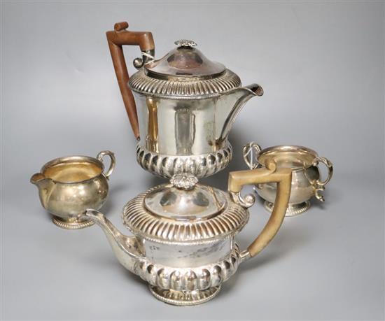 A silver milk jug and sugar bowl and a plated teapot and matching hot water jug,